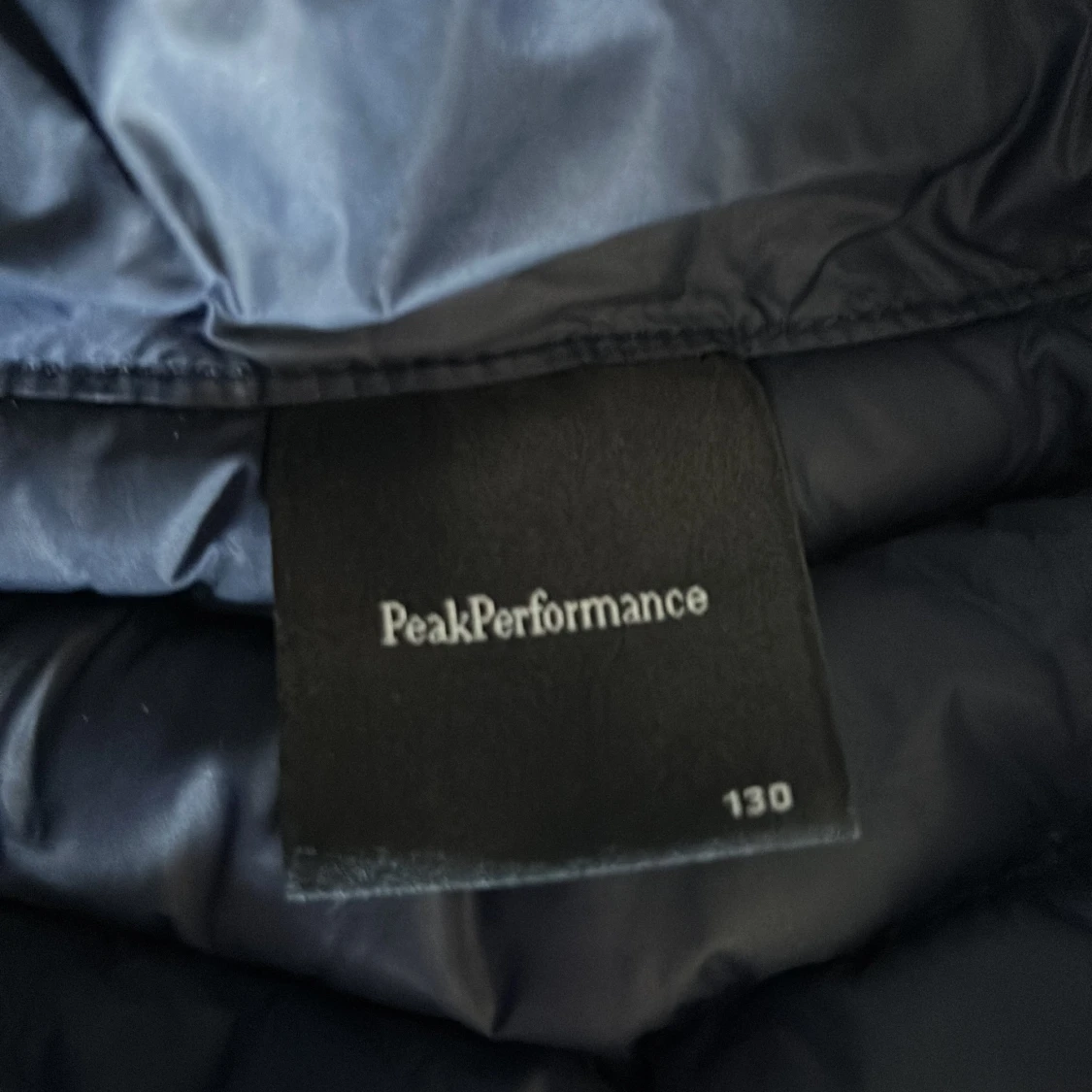 Blå dunjacka Peak Performance 130 - 1