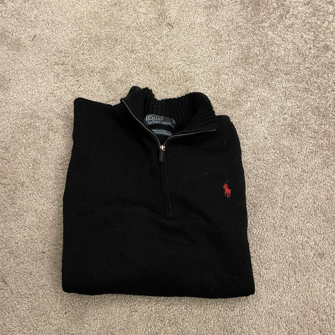 Svart stickad Ralph Lauren half zip. 