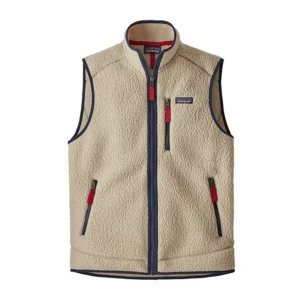 Beige fleeceväst från Patagonia - Snygg beige fleeceväst från Patagonia med marinblå detaljer och röda dragkedjor. Västen har hög krage, tre fickor med dragkedja. Mjuk och luftig som passar till många tillfällen. Storlek: small