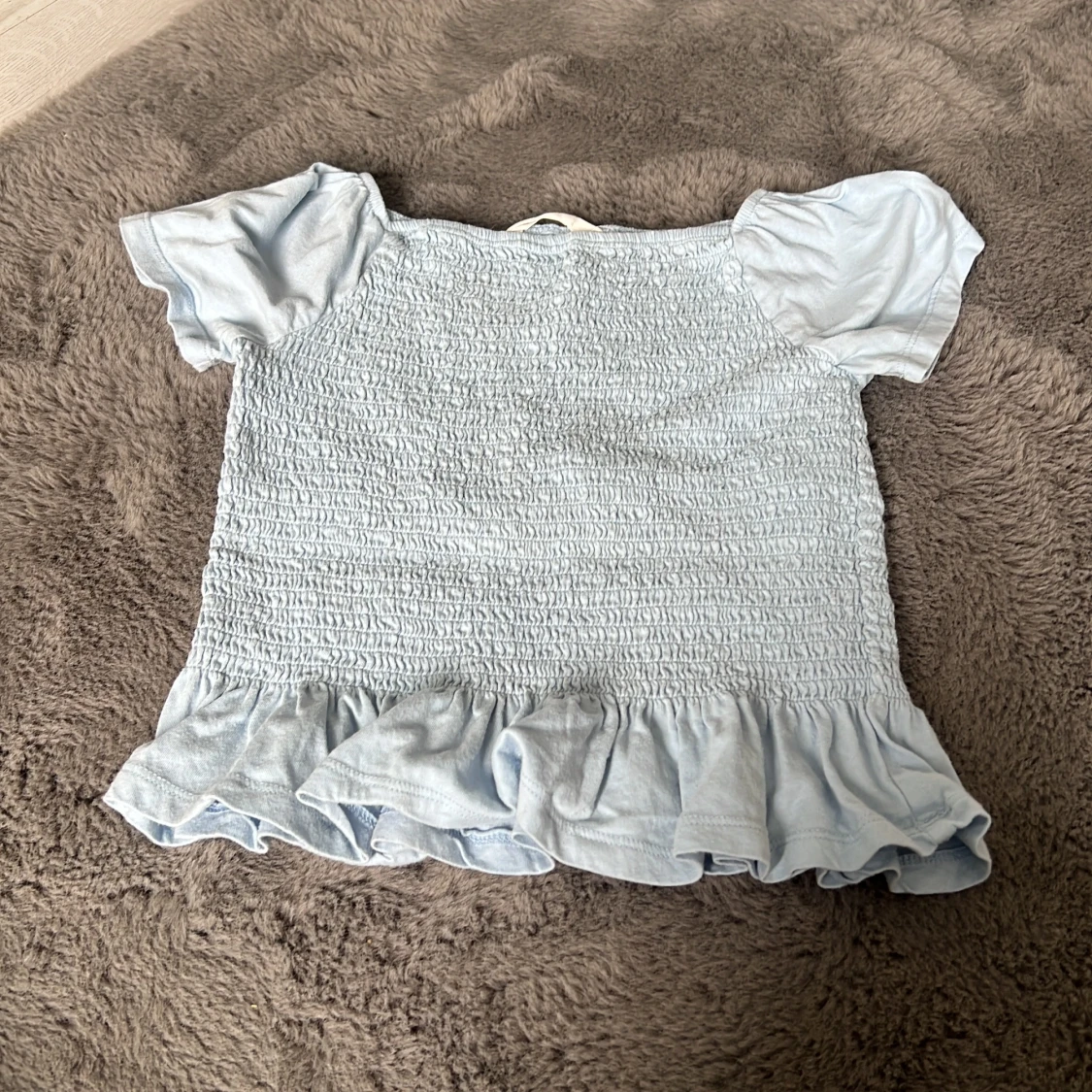 Ljusblå volangblus från H&M