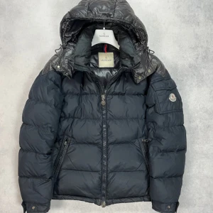 Moncler chevalier down jacket - – Condition: 7,5/10  – Size 2  – Retail price: 15 000 + SEK  Please note that Moncler runs small, we recommend going up one size from your usual size.  The model is 185 cm tall