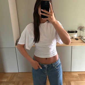 Vit t-shirt med långa ärmar från Nelly - Knappt använd!