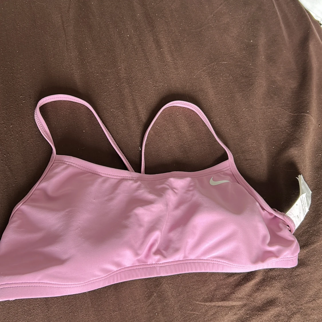 Ljusrosa linnetopp från Nike