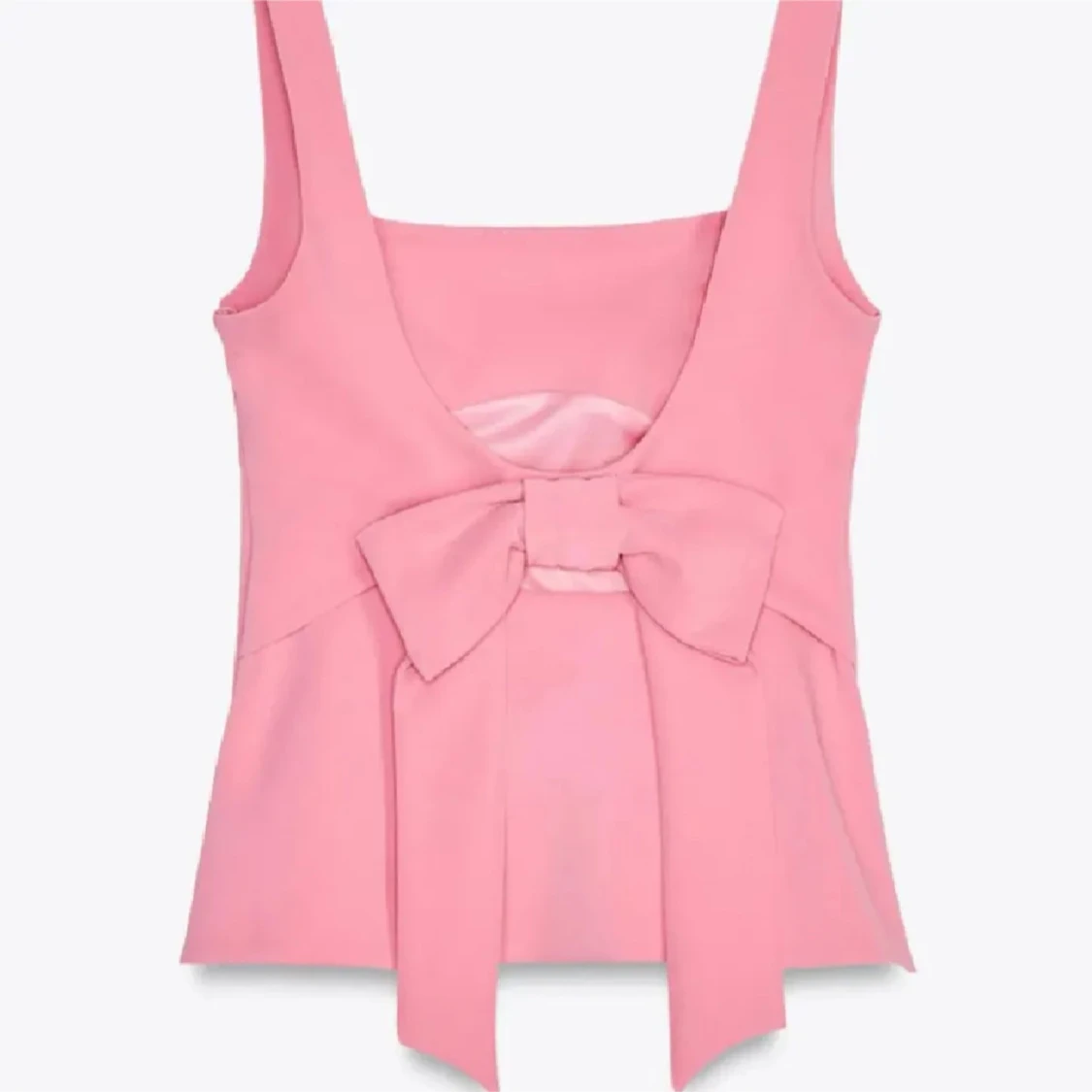 Rosa linnetopp med rosett