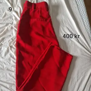 Röda kostymbyxor Nakeed i storlek 34
