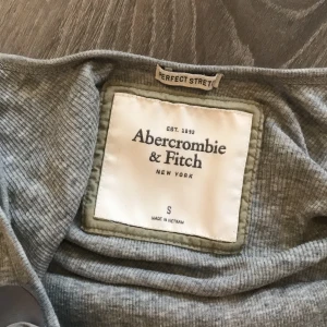 Abercrombie & Fitch tank top - Abercrombie tee that used to be my sisters but neither of us wear it anymore. In good condition. Comfortable elastic material. 