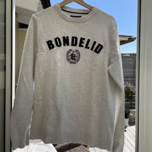 Grå Bondelid tröja - Grå stickad Bondelid tröja - Storlek L