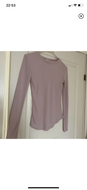 Topp - Ljusrosa Långärmad topp som liknar intimissimi toppen, från Gina i mjukt material