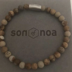 Atmband - Oanvänt Sons of Noa armband hett 