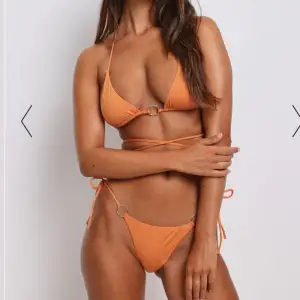 Orange bikini från nakd, aldrig använd!! Anledningen till sälj för liten🧡