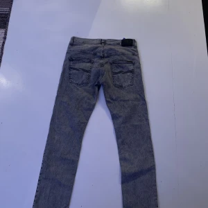Nudie Jeans - Strl 33/34 grey