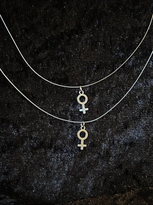 Venus (woman symbol) necklace  ♀ - Handmade necklaces with a sturdy wire for a "chain", not like a chocker but not sitting loosely like a "regular" necklace would! The pendants themself are silver plated but shouldn't be submerged in water🩵