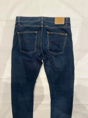 Nudie Lean Dean Jeans - Blå jeans i modellen Lean Dean, begagnade i mycket gott skick.