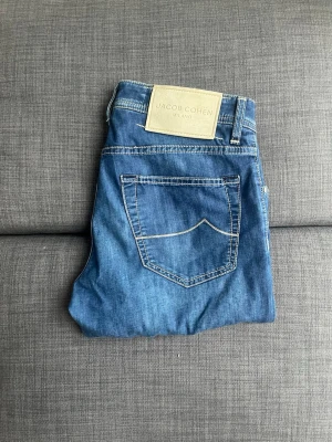 Jacob Cohen Nick Slim - Premium Jacob Cohën jeans crafted in Italy, combining timeless style with exceptional quality and comfort. The Nick Slim fit offers a modern silhouette with a refined look, perfect for both casual and elevated outfits.  Fast shipping • Carefully packaged • Feel free to message for more details.
