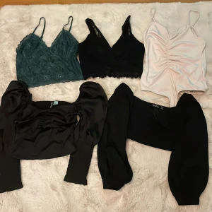 Toppar  - 5 toppar 50 kr. Från Gina, bikbok, hm och bitit Passar xs-s Fint skick, 2 svarta med armar oanvända
