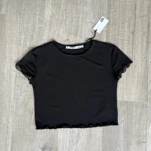 Meshtopp - Svart meshtopp stl S. Aldrig använd 