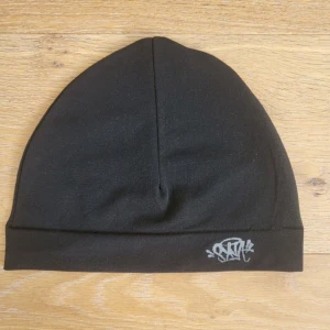 Syna world mössa  - Fett mössa för fett pris 