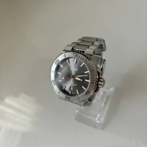 Oris Aquis Date - • Modell: Oris Aquis Date • Storlek: 43,5mm • Referens: 01 733 7730 4153 • År: 2020 • Skick: Mycket Bra • Medföljer: Fullset