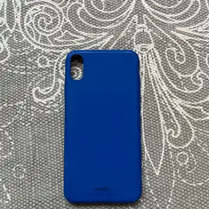 Mörkblått holdit mobilskal som inte används längre då jag har köpt ny mobil