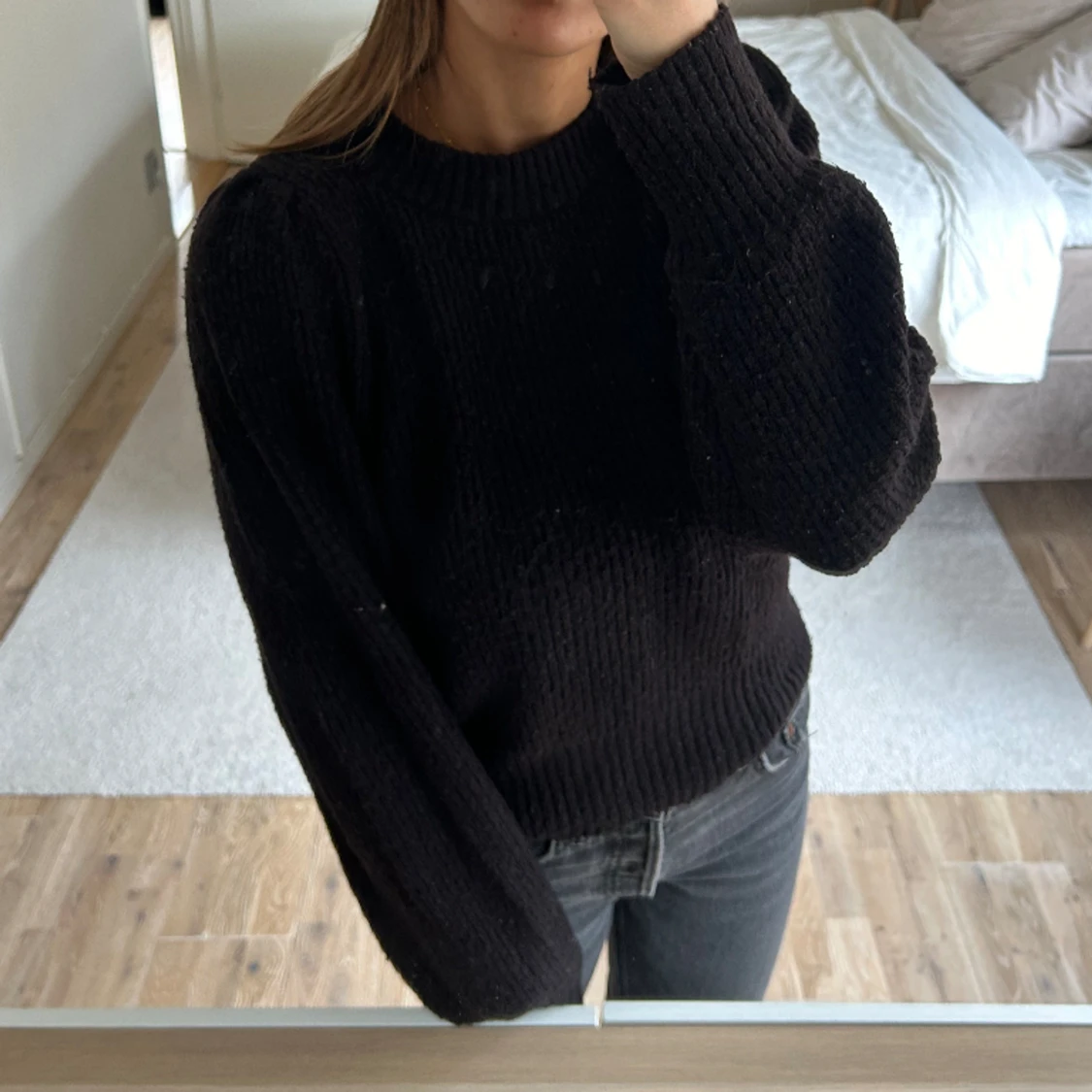 Svart stickad