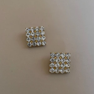 Vintage Crystal Grid Earrings - Set of Vintage Golden Clip earrings with a square grid of crystals. A lovely vintage gift.   Very Good Condition  Clip Earrings.