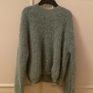 Trokos stickad tröja  - En stickad tröja storlek 158-164