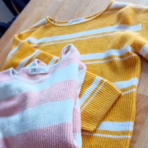 Två stickde tröjor från h&m. En rosa och en gul orange båda har vita ränder.  