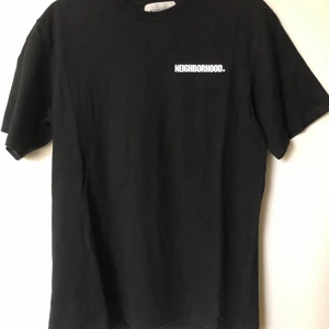 Neighborhood / NBHD Back Logo Tee - Neighborhood / NBHD Back Logo T-Shirt  Size tag large, but fits like a men’s small tee.  Great condition, no flaws or damage.  DM if you need exact size measurements.   Buyer pays for all shipping costs. All items sent with tracking number.   No swaps, no trades, no offers. 