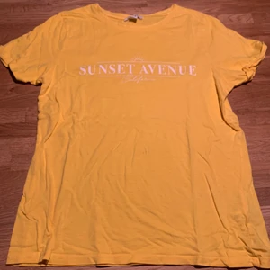 Yellow t-shirt“sunset avenue California” - It’s perfect for a hot summer day, or on a cold fall day under a jacket. It’s very thin and gives happy vibes.