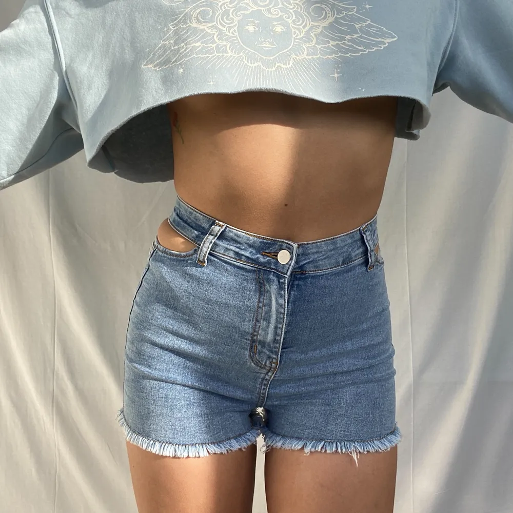 HEY I’m selling these new jeans shorts I ordered from pretty little thing. They are a size 10/ 38 and have cut outs in the waist area. They’re super soft and easy to style. SALE IS ONLY UNTIL 10. JUNE!!. Shorts.