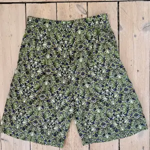 Flowy silk shorts; size S; never worn; blue green white pattern 