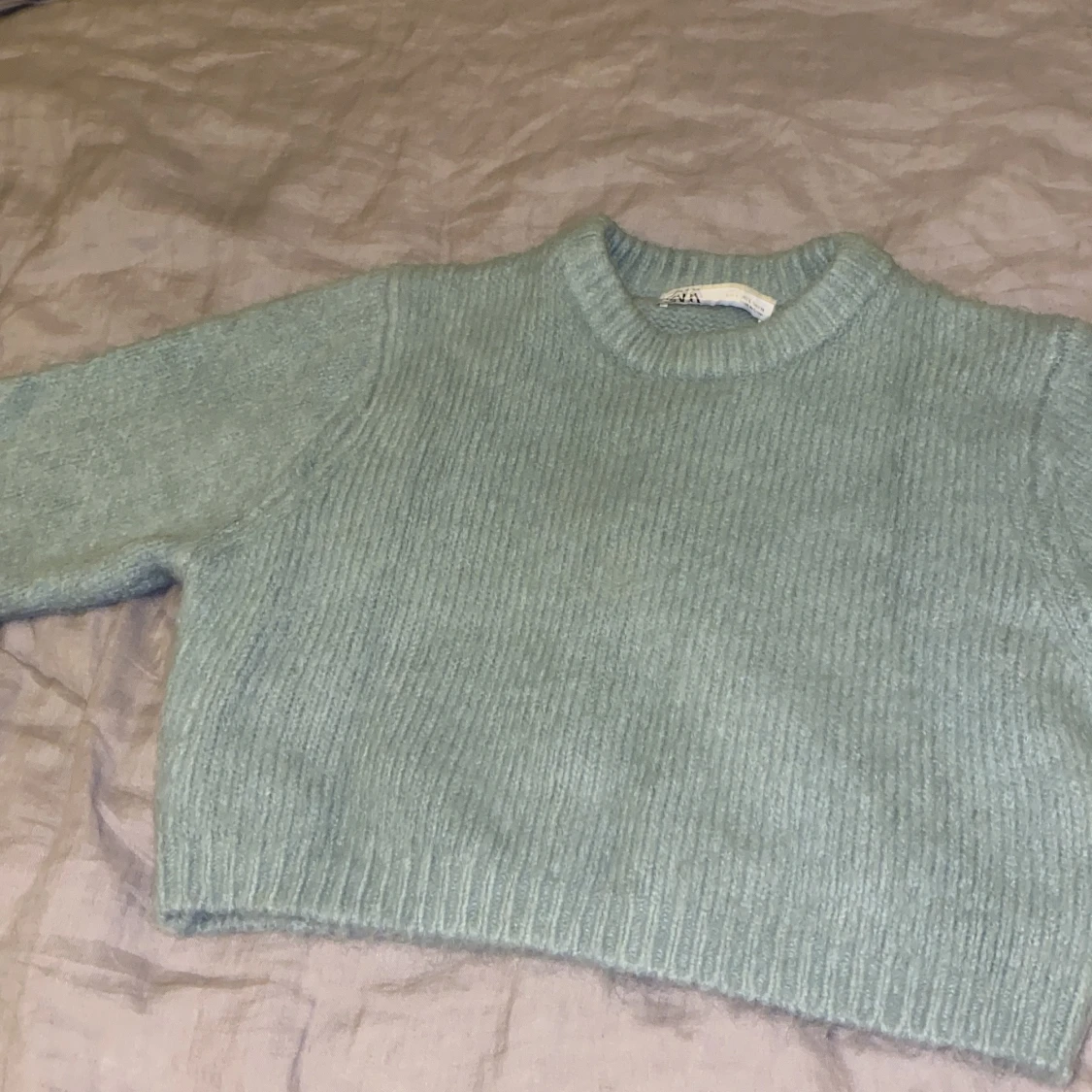 Stickad grön tröja
