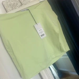 Kjol Angelica blick x NA-KD  - Kort omlottkjol , storlek 36