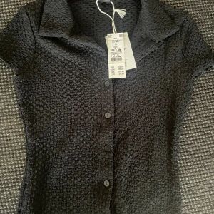 Topp från Gina tricot - Aldrig använd helt ny!