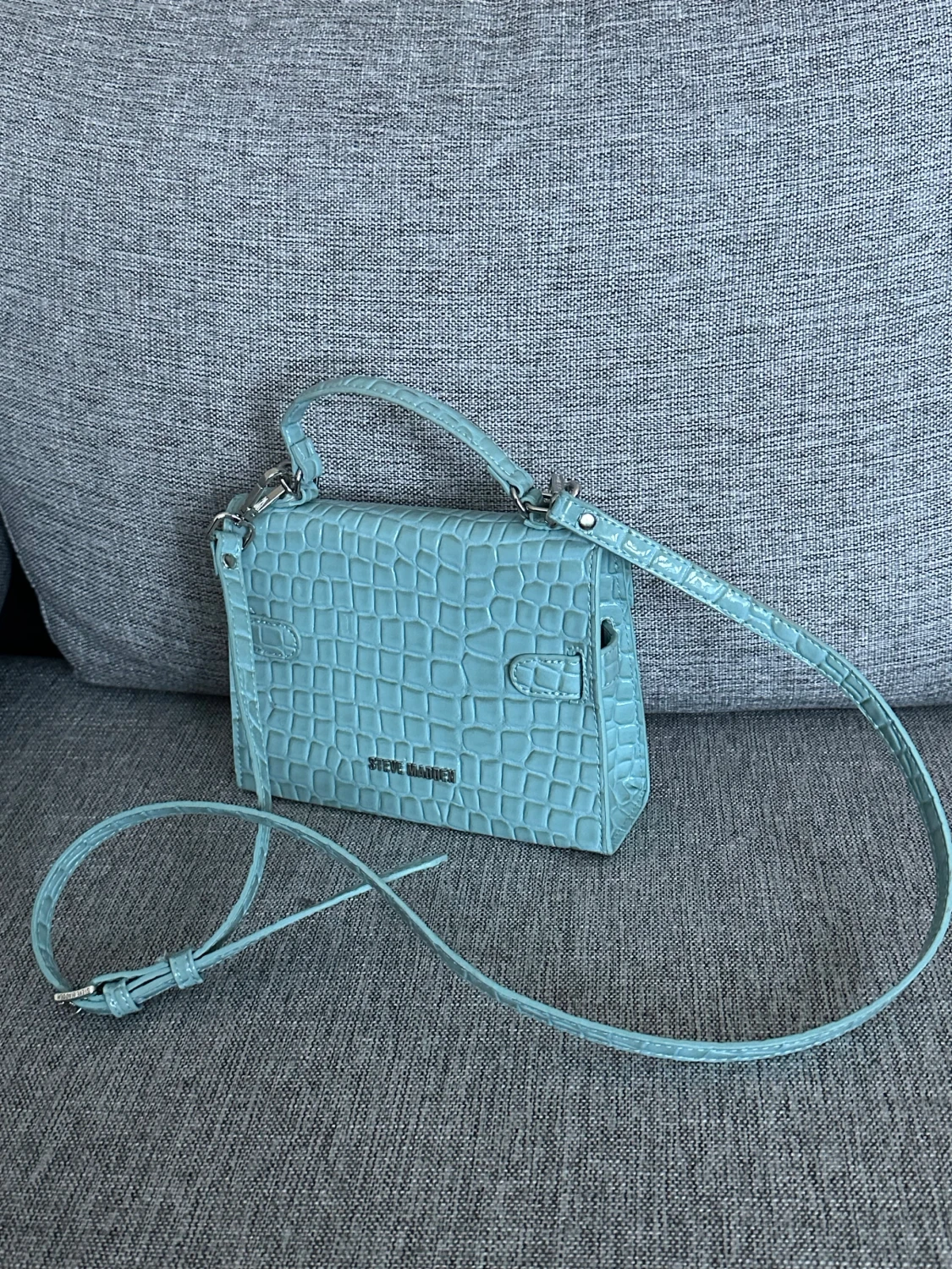 Turkos axelväska från Steve Madden