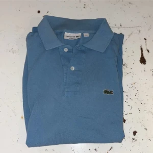 Lacoste piké  - En Lacoste piké i storlek M 