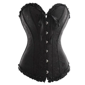 Svart korsett med snörning och spets - Säljer en svart korsett som är helt perfekt till halloween outfits som playboy Bunny, katt, Katherine Pierce, burlesque, spion,, vampyr. Korsetten har spetsdetaljer längs kanterna och snörning i ryggen. Framtill finns knäppning och en rosett. Modellen är axelbandslös och har en figurnära passform som ger en snygg siluett. Använd endast ett fåtal gånger! Storleken är justerbar så skulle säga att den passar från M-L. Pris kan diskuteras, jag möts gärna upp om du vill slippa betala frakt❤️