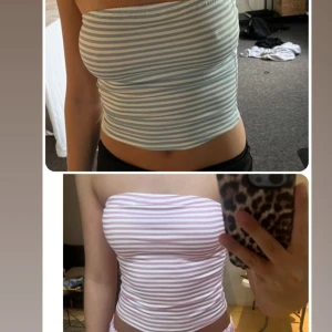 2 Randiga tubtoppar  - Två bandeau tubtoppar i bomull, ena i ljusblått och vitt, andra i ljusrosa och vitt. Båda har stretch i sig så dom är S men passar M o L oxå. 