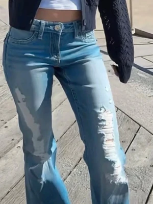 Gina iconic twisted jeans - Lågmidjade jeans i Flared modell från Gina Young