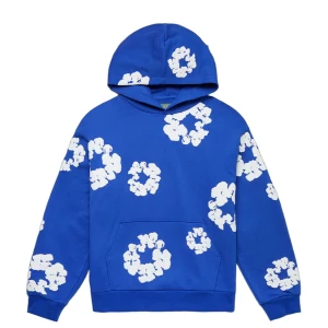 Blå hoodie med blommigt tryck Denim Tears - Blå hoodie från Denim Tears. Tröjan har klassisk Luva och magficka, samt ribbade muddar vid ärmslut och nederkant. Perfekt för dig som gillar streetwear med unik design.
