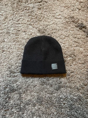 Mössa - Helt oanvänd. Skriv om du vill ha fler bilder eller vid andra frågor.