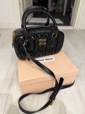 Miu Miu black leather purse/bag - Brand new with no defects. Original, Please send an offer :) Bought on Vinted with item verification and its 100% real