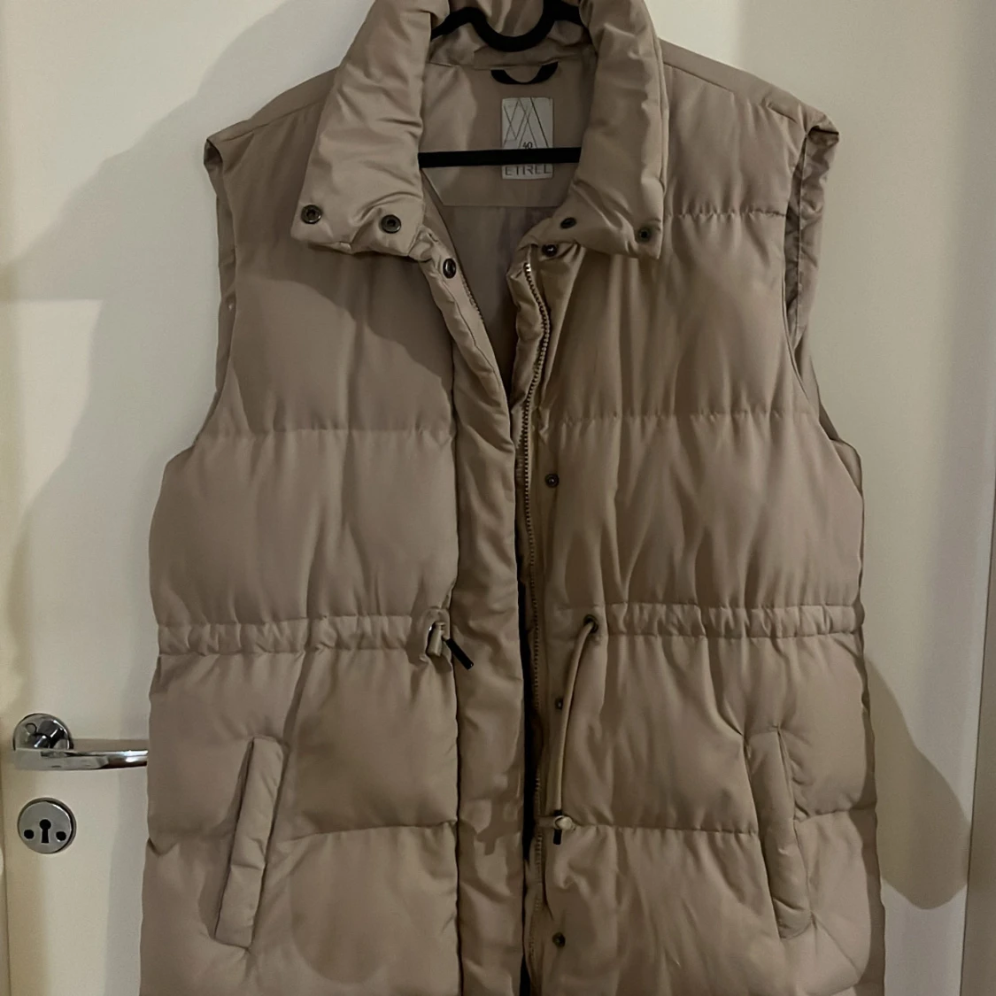 Beige dunväst från Etrel - 2