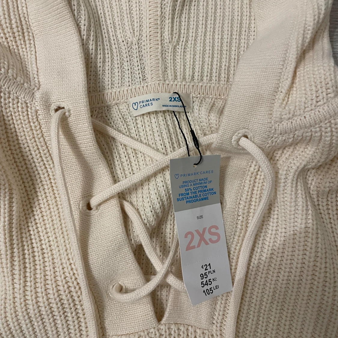 Beige stickad hoodie från Primark - 92