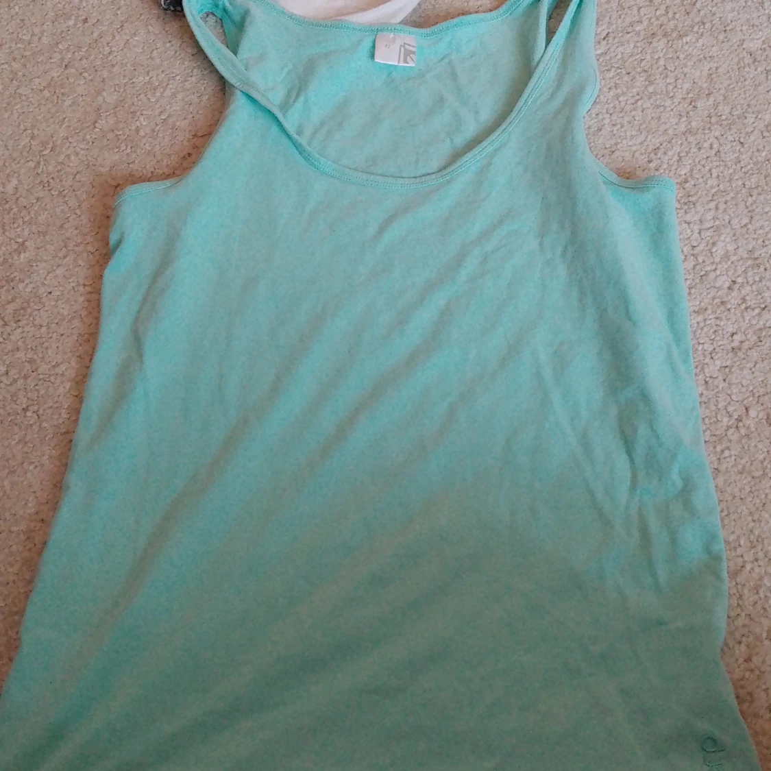 Turkos ärmlös linnetopp