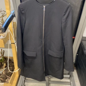 Kappa - Svart kappa i bra skick