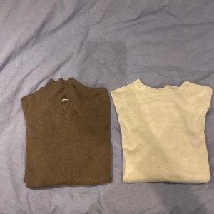 Brun och vit tröja i supima ull från Dressman - Säljer en brun och en vit  tröja från Dressmann i mjukt Supima bomull. Båda är i storlek S och är i mycket bra skick. Skick 10/10. Den bruna tröjan har en ribbad krage med en liten v-ringning. Perfekta för en stilren och bekväm look. Båda för 350kr och en för 250kr. Ifall ni undrar något ytligare eller vill få fler bilder så är det bara att skriva.