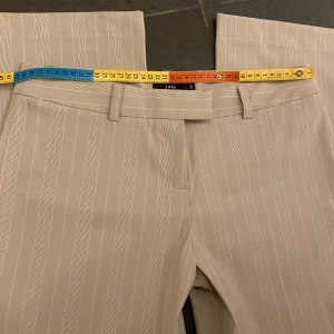 Kostymbyxor  - Beiga randiga kostymbyxor Iprincip oanvända