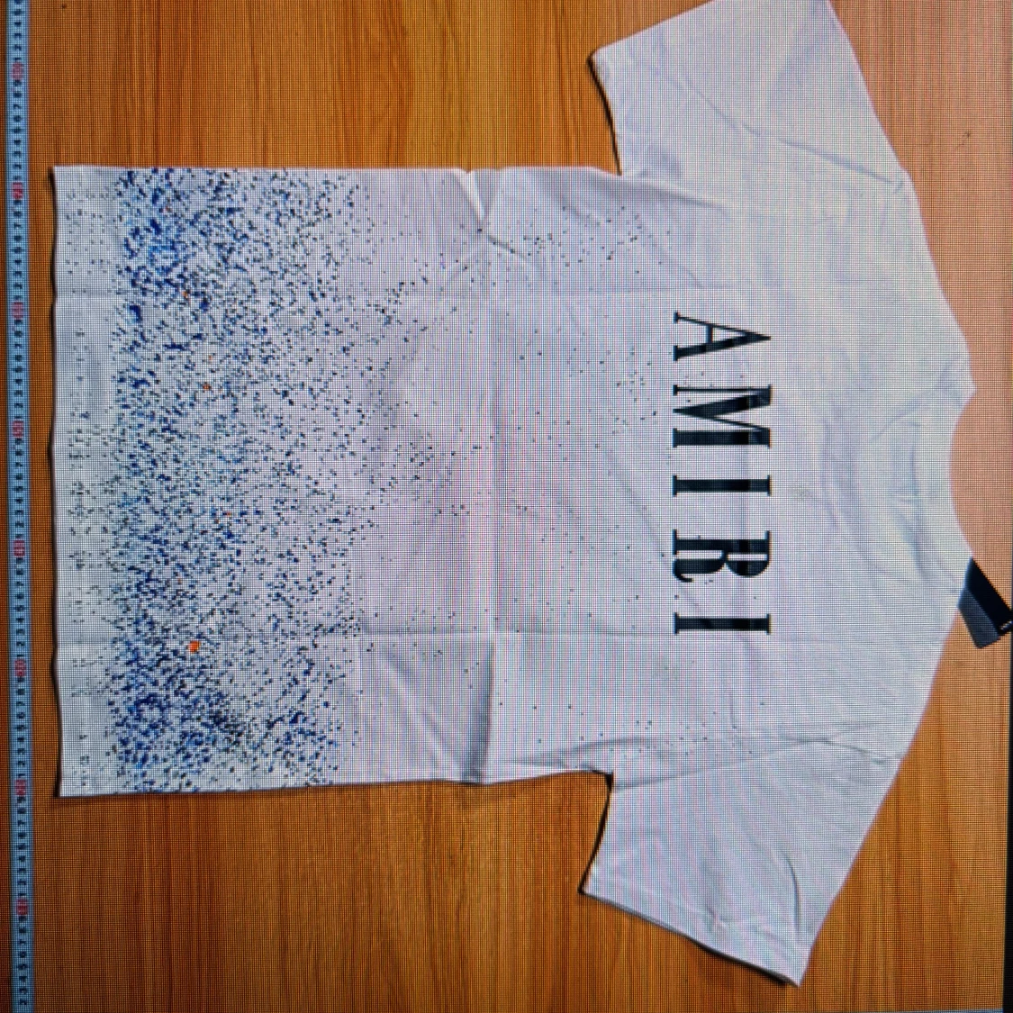 Vit t-shirt från Amiri med blått stänkmönster