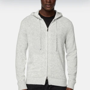 Grå hoodie med dragkedja - Säljer en stilren grå half blend cashmere hoodie med dragkedja. Perfekt för både vardag och chill. Den har en mjuk och bekväm passform med långa ärmar och en praktisk huva. Nypris 3000. Säljer för 1000kr.